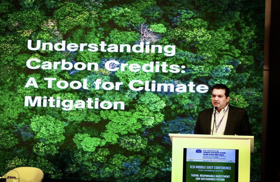 Dr. Rajesh Pai speaking on stage